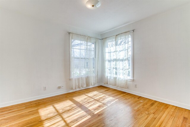 214 S Clark St, Rockwall, TX 75087 - empty room featuring wood finished floors and baseboards