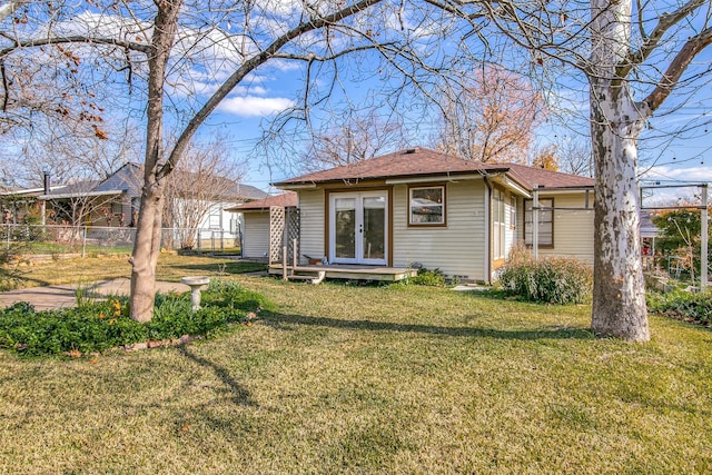 214 S Clark St, Rockwall, TX 75087 - rear view of house with french doors and a shingled roof