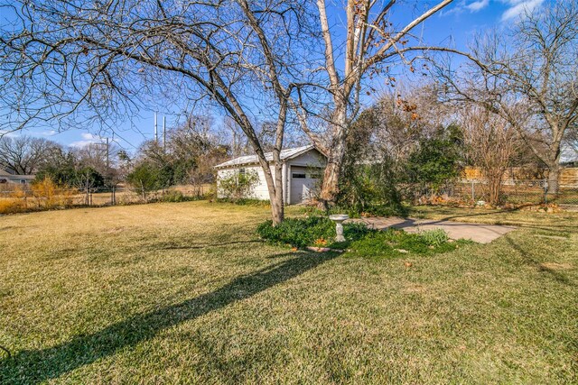 214 S Clark St, Rockwall, TX 75087 - view of yard with an outdoor structure and a garage