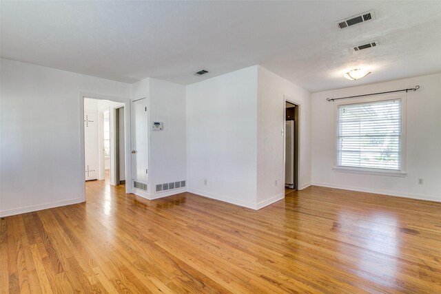 214 S Clark St, Rockwall, TX 75087 - unfurnished room with light wood-style floors and baseboards