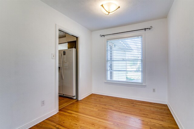 214 S Clark St, Rockwall, TX 75087 - spare room with light wood-style flooring and baseboards