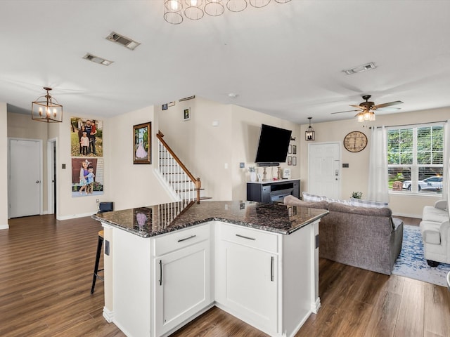5221 Wheat Sheaf Trl, Fort Worth, TX 76179 - kitchen featuring open floor plan, dark wood-style floors, a chandelier, and white cabinetry