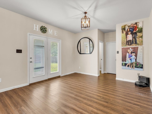 5221 Wheat Sheaf Trl, Fort Worth, TX 76179 - unfurnished dining area with a chandelier, wood finished floors, and baseboards