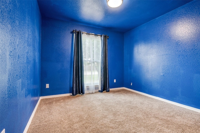 110 Commonwealth Cir, Waxahachie, TX 75165 - unfurnished room with baseboards, carpet floors, and a textured wall