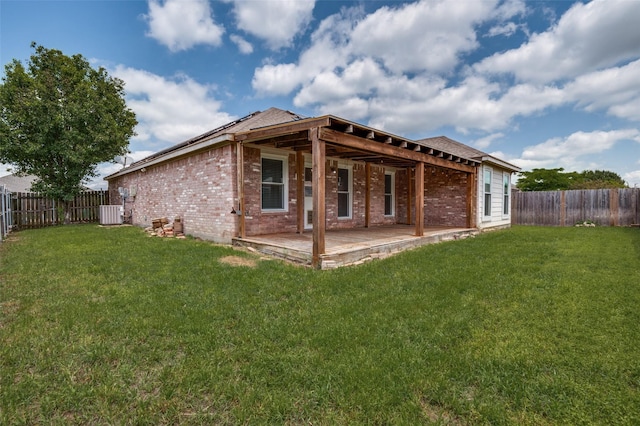 110 Commonwealth Cir, Waxahachie, TX 75165 - rear view of house featuring brick siding, a patio area, roof with shingles, and central air condition unit