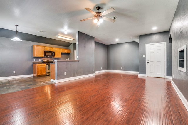 110 Commonwealth Cir, Waxahachie, TX 75165 - unfurnished living room featuring ceiling fan, dark wood-type flooring, baseboards, and lofted ceiling