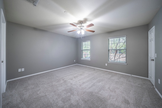 4928 Heather Glen Trl, Mckinney, TX 75070 - empty room with a ceiling fan, carpet flooring, and baseboards