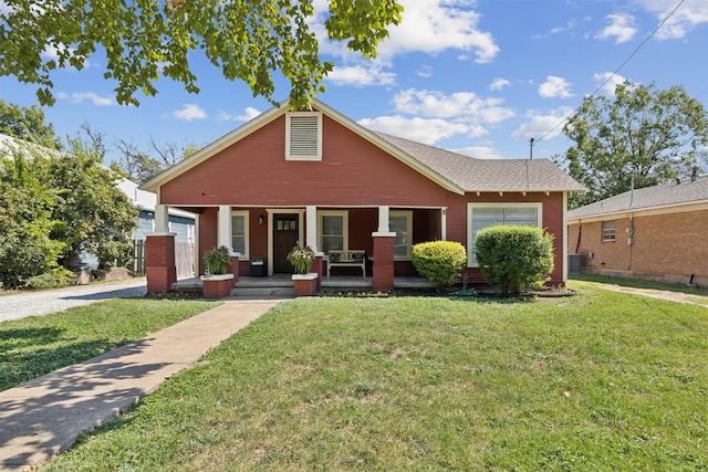 bungalow with a porch and a front yard