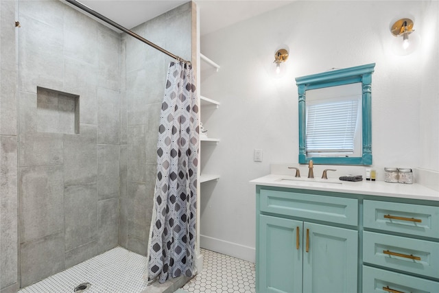 bathroom featuring vanity, tiled shower, and tile patterned floors
