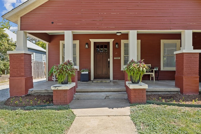 doorway to property with a porch