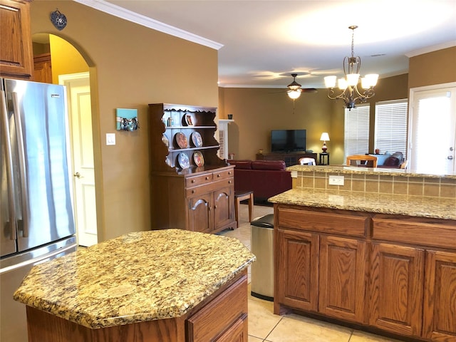 4210 Creek Falls Dr, Corinth, TX 76208 - kitchen with freestanding refrigerator, ornamental molding, arched walkways, a ceiling fan, and light tile patterned flooring