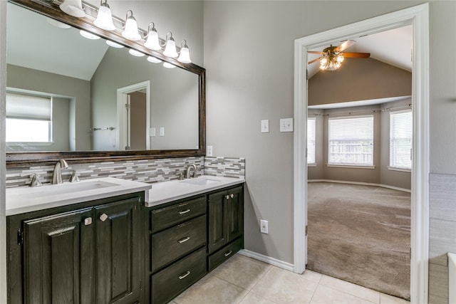 full bathroom with lofted ceiling, a ceiling fan, healthy amount of natural light, and decorative backsplash