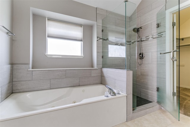 bathroom featuring a shower stall, tile patterned flooring, and a whirlpool tub