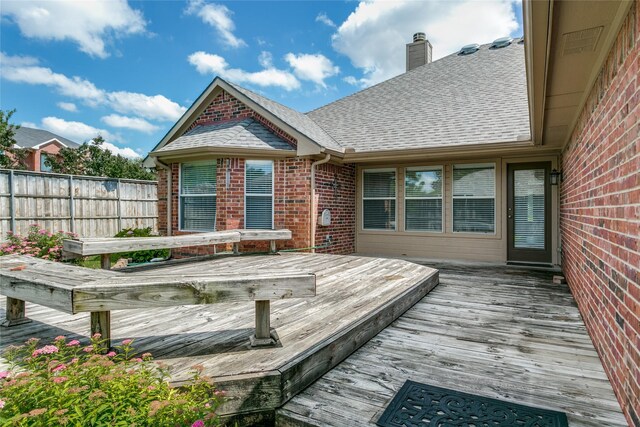 wooden deck featuring fence