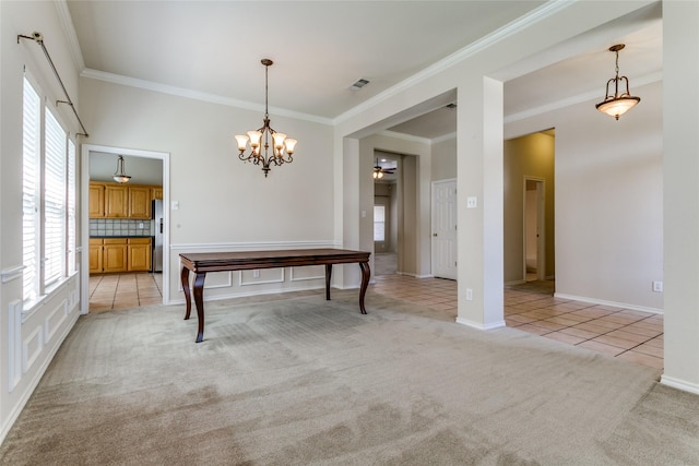 unfurnished dining area featuring crown molding, healthy amount of natural light, light carpet, a chandelier, and light tile patterned flooring