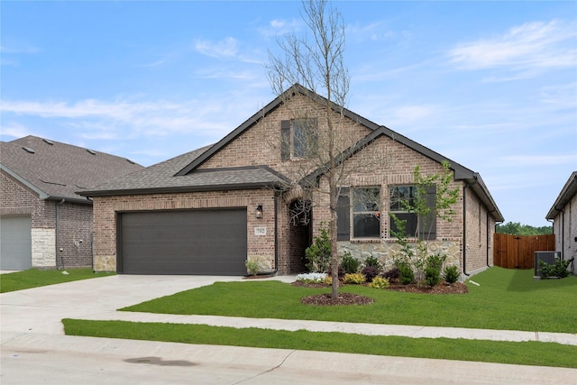 702 Roanoke, Princeton, TX 75407 - view of front of house featuring concrete driveway, a garage, brick siding, a shingled roof, and central AC