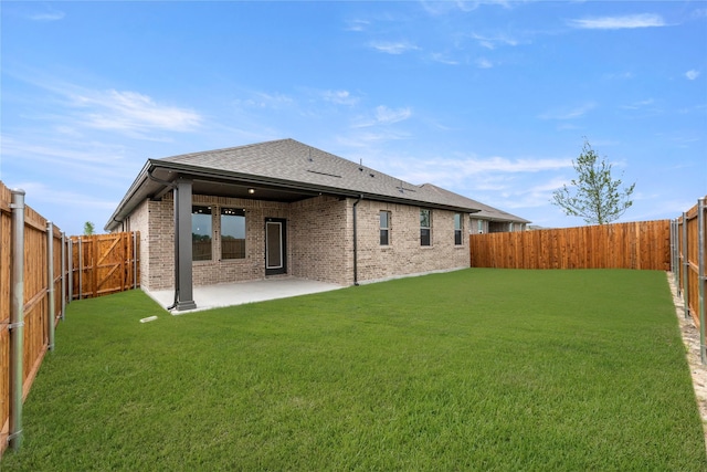 702 Roanoke, Princeton, TX 75407 - rear view of house with brick siding, a shingled roof, and a patio area