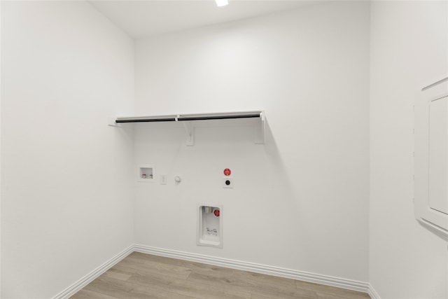 702 Roanoke, Princeton, TX 75407 - laundry area with hookup for a gas dryer, hookup for an electric dryer, light wood-style floors, baseboards, and washer hookup