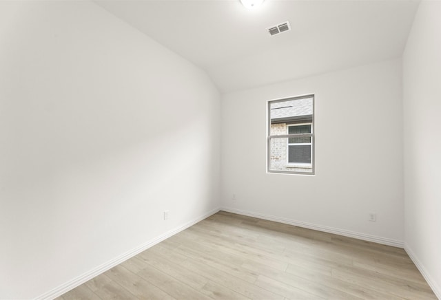 702 Roanoke, Princeton, TX 75407 - empty room with light wood-type flooring, baseboards, and lofted ceiling