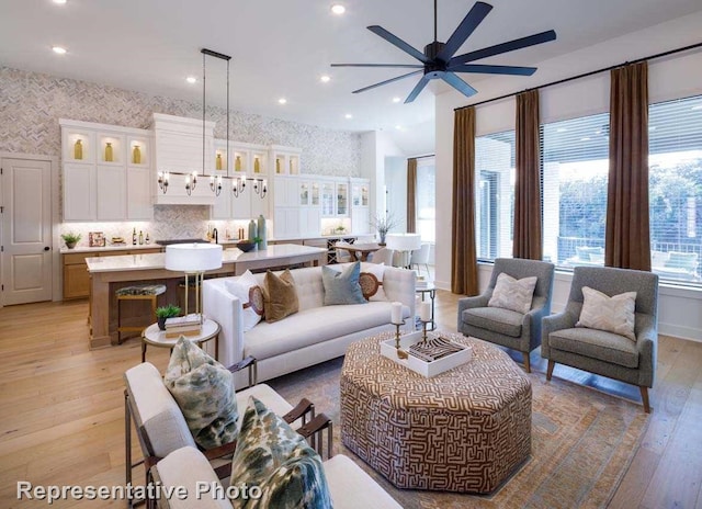 1409 Sire Ct, Aubrey, TX 76227 - living area with a ceiling fan, light wood-style floors, recessed lighting, wallpapered walls, and baseboards