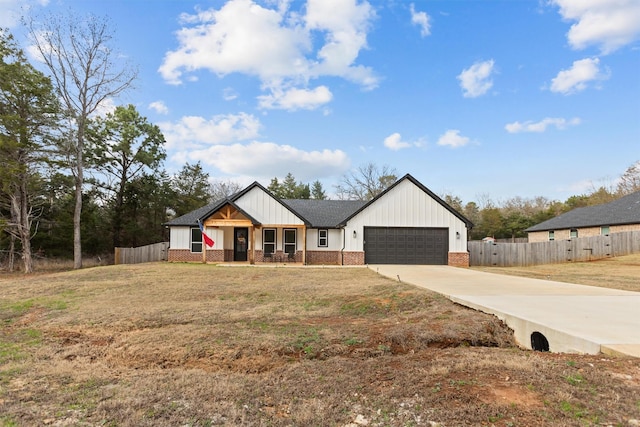 modern farmhouse with an attached garage, driveway, brick siding, board and batten siding, and a porch