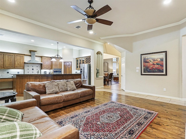 6769 Canal Ct, Grand Prairie, TX 75054 - living area featuring light wood finished floors, ceiling fan, crown molding, recessed lighting, and baseboards