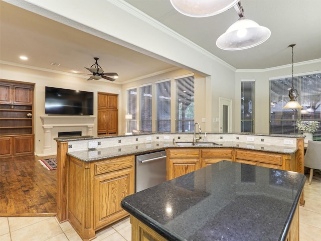 6769 Canal Ct, Grand Prairie, TX 75054 - kitchen with a sink, a spacious island, dishwasher, tasteful backsplash, and ceiling fan