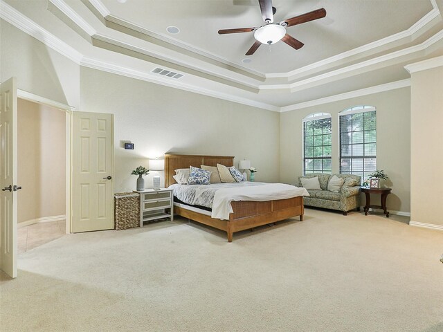 6769 Canal Ct, Grand Prairie, TX 75054 - carpeted bedroom featuring a tray ceiling, crown molding, baseboards, and ceiling fan