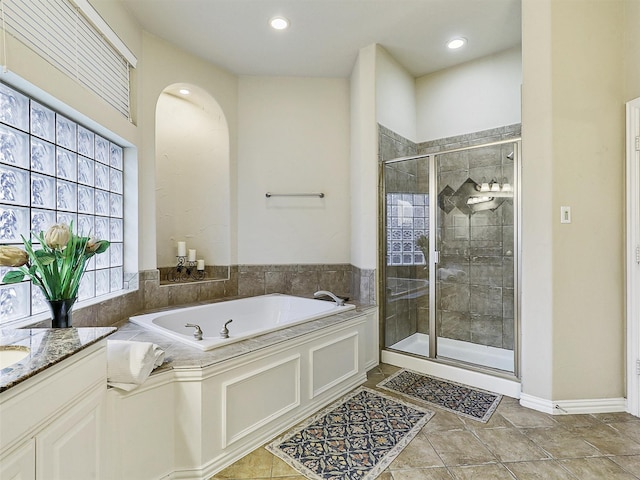 6769 Canal Ct, Grand Prairie, TX 75054 - bathroom featuring a bath, a stall shower, vanity, recessed lighting, and tile patterned flooring
