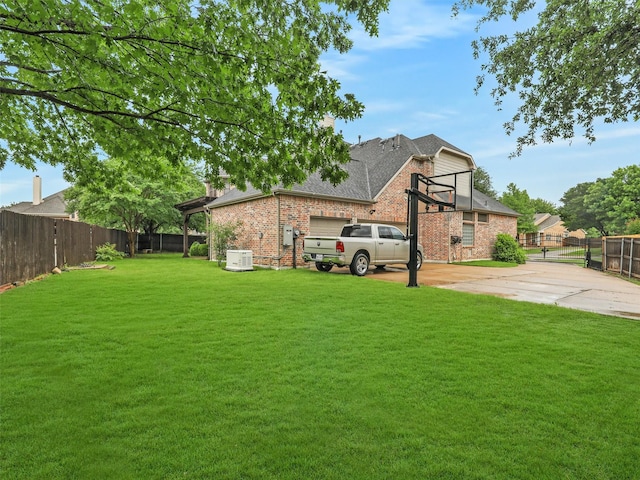 6769 Canal Ct, Grand Prairie, TX 75054 - view of yard featuring concrete driveway and central AC unit