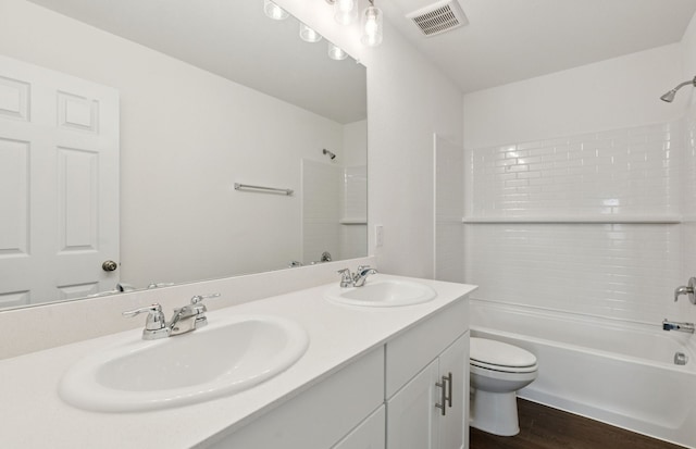 1053 Clear Dusk Ln, Forney, TX 75126 - bathroom with double vanity, shower / bath combination, and wood finished floors