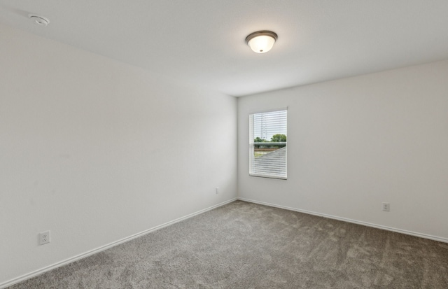 1053 Clear Dusk Ln, Forney, TX 75126 - spare room featuring carpet floors and a smoke detector