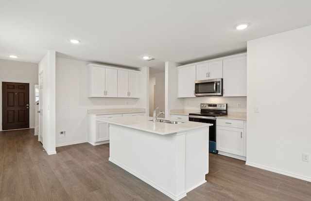 1053 Clear Dusk Ln, Forney, TX 75126 - kitchen featuring appliances with stainless steel finishes, wood finished floors, light countertops, white cabinetry, and recessed lighting
