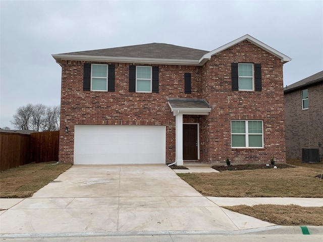 2617 Silver Leaf Ln, Anna, TX 75409 - traditional-style house with an attached garage, brick siding, concrete driveway, roof with shingles, and central AC