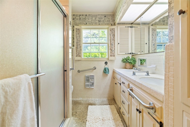 214 Country Club Rd, Hillsboro, TX 76645 - full bathroom featuring a stall shower, double vanity, speckled floor, and toilet