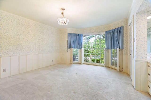 214 Country Club Rd, Hillsboro, TX 76645 - spare room with wallpapered walls, crown molding, wainscoting, a chandelier, and carpet floors