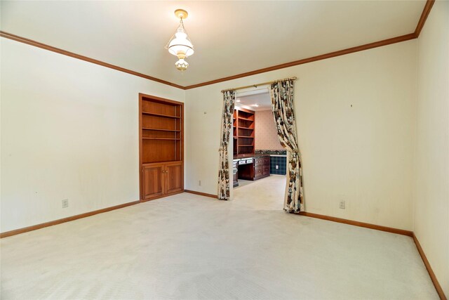 214 Country Club Rd, Hillsboro, TX 76645 - carpeted empty room featuring crown molding, baseboards, and built in shelves