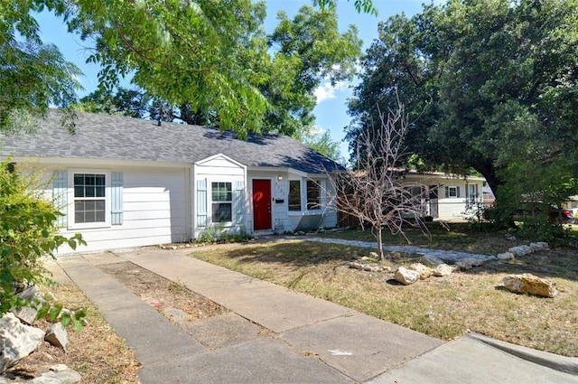 4363 Lisbon St, Fort Worth, TX 76107 - ranch-style home featuring a front yard and a shingled roof
