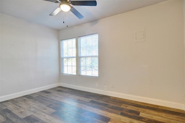4363 Lisbon St, Fort Worth, TX 76107 - empty room with dark wood-style flooring, baseboards, and a ceiling fan