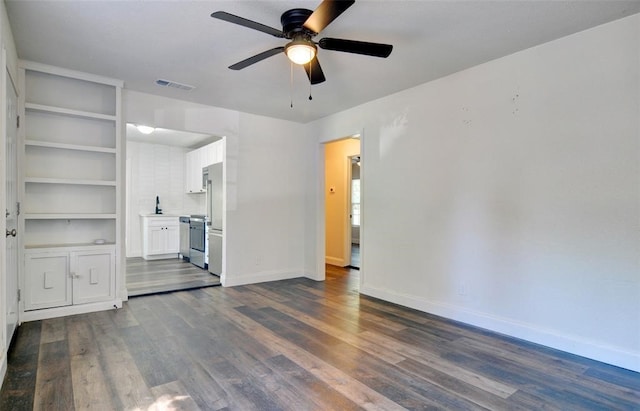 4363 Lisbon St, Fort Worth, TX 76107 - unfurnished living room with a ceiling fan, dark wood-style floors, baseboards, and a sink