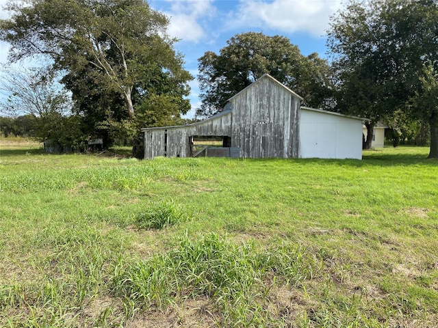 718 Ender Rd, Waco, TX 76706 - view of grassy yard with an outdoor structure and an outbuilding