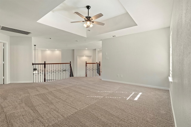 10101 Waterview Pkwy, Rowlett, TX 75089 - unfurnished room with a ceiling fan, carpet, and a tray ceiling