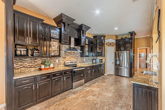 kitchen featuring stainless steel appliances, wall chimney range hood, a sink, tasteful backsplash, and crown molding