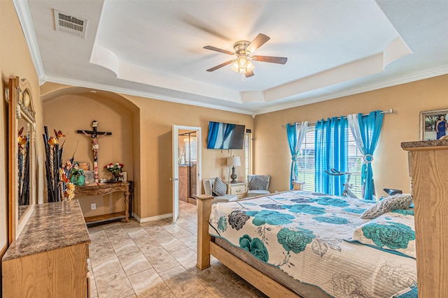 bedroom featuring a raised ceiling, ornamental molding, and ceiling fan