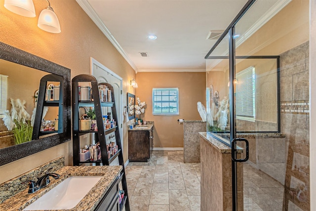 bathroom featuring crown molding, a stall shower, two vanities, and baseboards