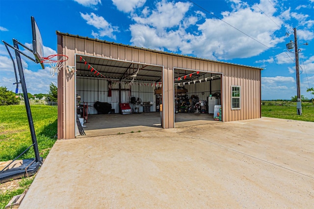 view of parking featuring an outbuilding