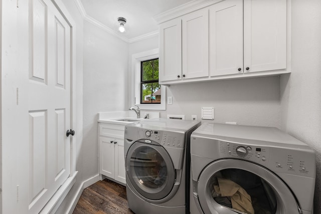 608 N Belknap, Stephenville, TX 76401 - laundry area featuring cabinet space, washing machine and dryer, crown molding, dark wood-style floors, and baseboards