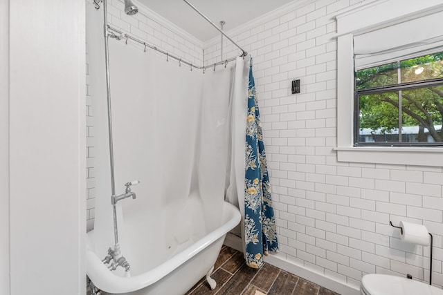 608 N Belknap, Stephenville, TX 76401 - bathroom featuring ornamental molding, wood finished floors, tile walls, and toilet
