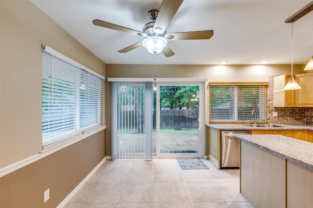 410 Lone Oak Cir, Euless, TX 76039 - kitchen featuring dishwasher, a sink, a ceiling fan, baseboards, and tasteful backsplash