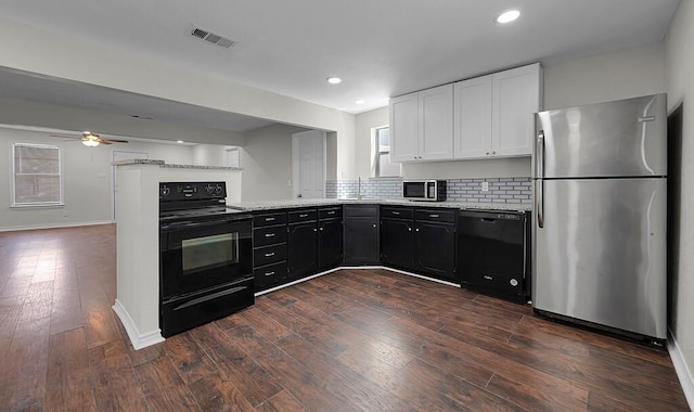 2709 Sarah St, Waco, TX 76706 - kitchen featuring black appliances, a sink, dark cabinetry, white cabinets, and a peninsula